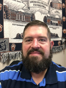 Smiling bearded man in a