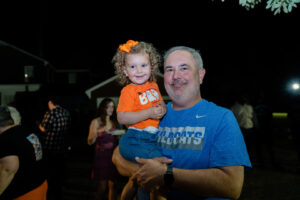Man holding a smiling child