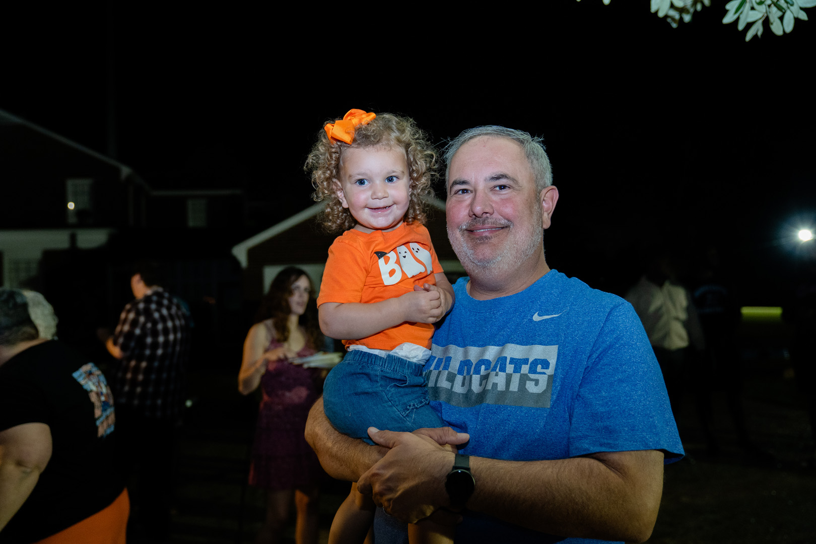 Man holding a smiling child