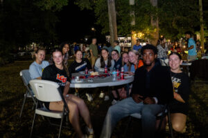 Smiling young adults at an outdoor night