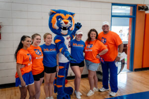 Group of people in Wildcat and Alumni