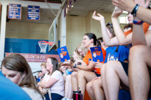Basketball fans in a gym,