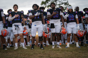 Louisiana football players in black