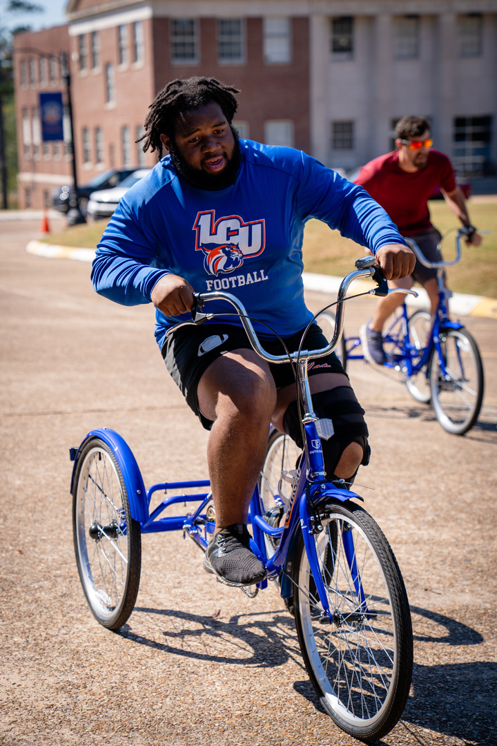 Man in LCU Football shirt