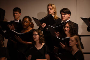 A diverse choir of young adults in