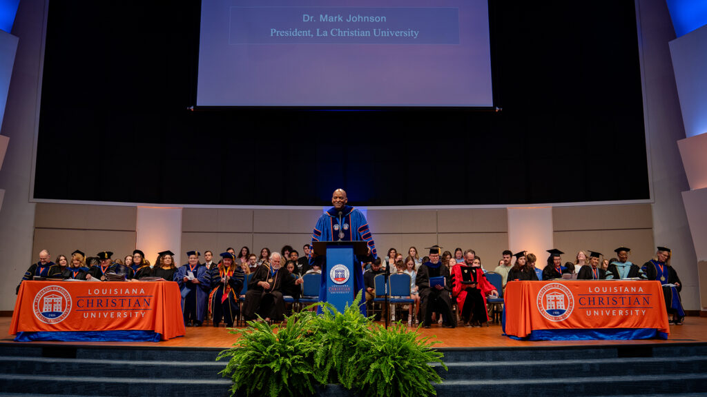 Dr. Johnson, faculty, and students on stage at Honors Convocation.