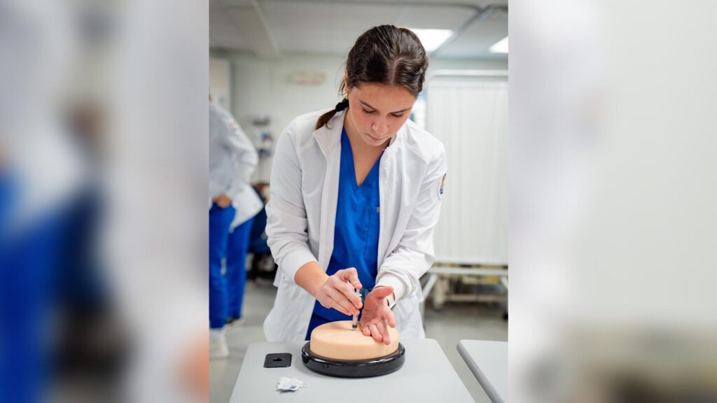 Nursing student from the 2025-26 cohort learning the proper shot technique.