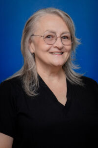 Smiling woman with gray hair