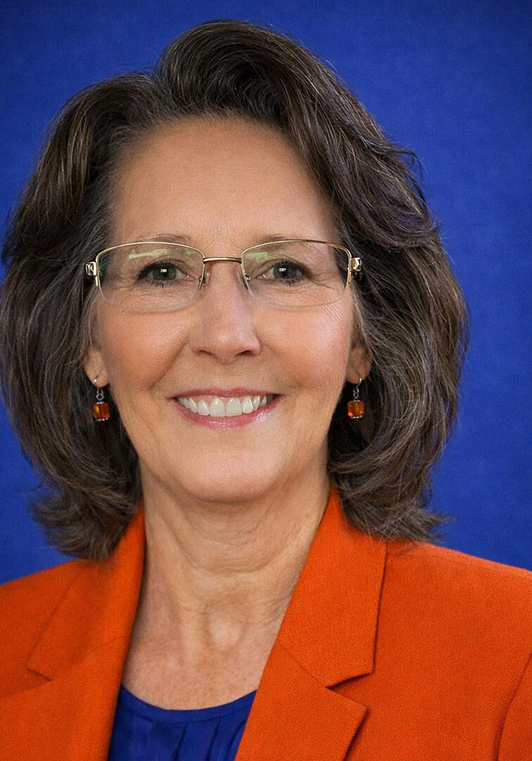 Professional headshot of a smiling